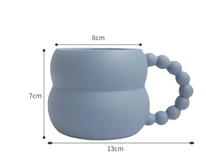 Tasse à café en céramique avec anse en boule – Design créatif et élégant